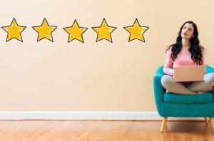 Five Star Rating with young woman using a laptop computer